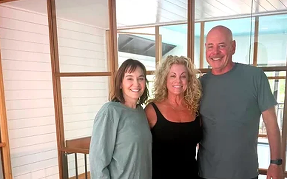 A Blue Sky Pilates instructor with two clients after a private session in the studio